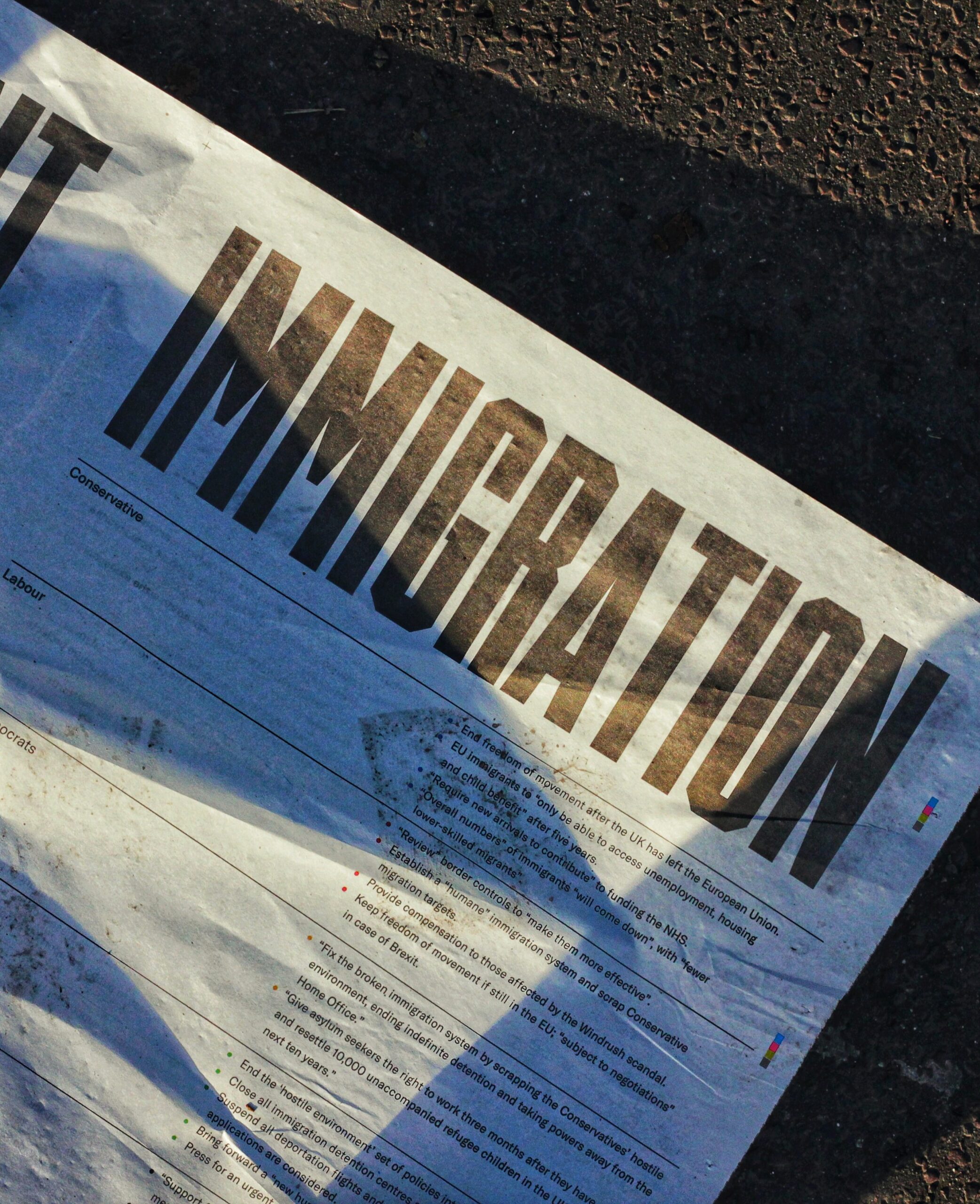 A newspaper with immigration as the headline